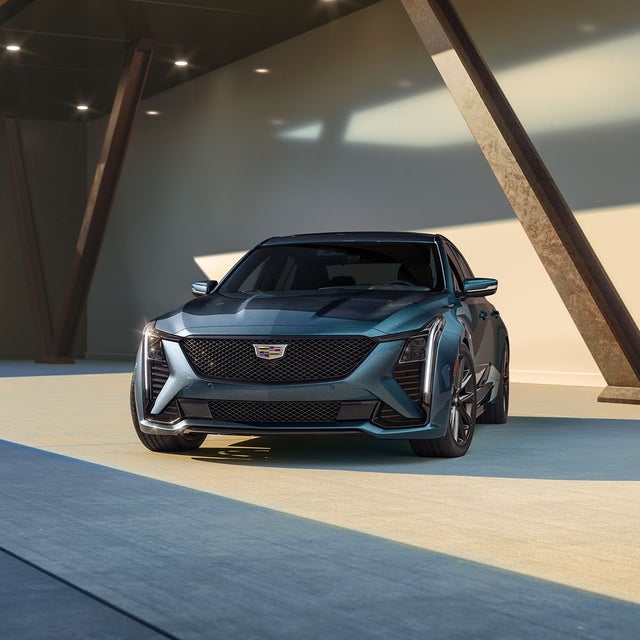 Front View of the Sleek 2025 Cadillac CT5 Sport Parked in Warehouse