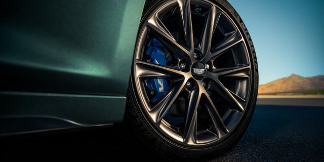 Low Angle View of a Front Tire Of a 2025 Cadillac CT5-V Driving Down the Road